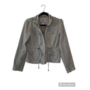 American Rag denim jacket. Light olive green. Rollable sleeves, zip front, hood.